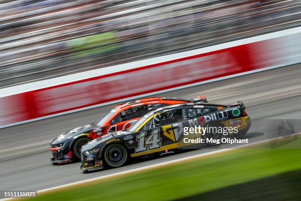 Chase Briscoe, driver of the Mobil 1 Gen G Ford, and Ross Chastain, driver of the Kubota Chevrolet, race during the NASCAR Cup Series Crayon 301 at...