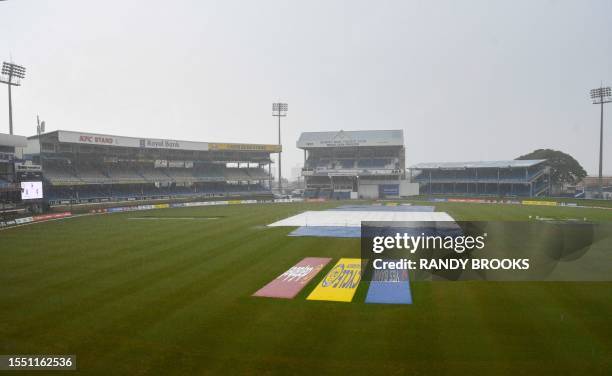 Rain delays play during the fifth and final day of the second Test cricket match between India and West Indies at Queen's Park Oval in Port of Spain,...