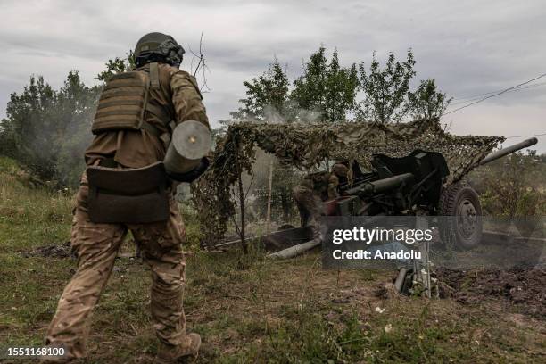 Ukrainian soldiers reload their 'Rapira' artillery with shells in the direction of Bakhmut, Ukraine, 22 July 2023.