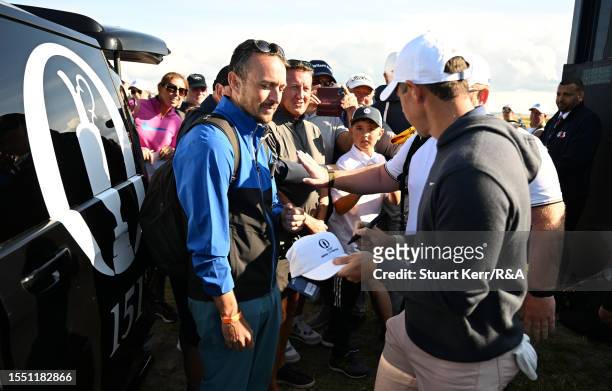 Rory McIlroy of Northern Ireland signs an autograph prior to The 151st Open at Royal Liverpool Golf Club on July 17, 2023 in Hoylake, England.