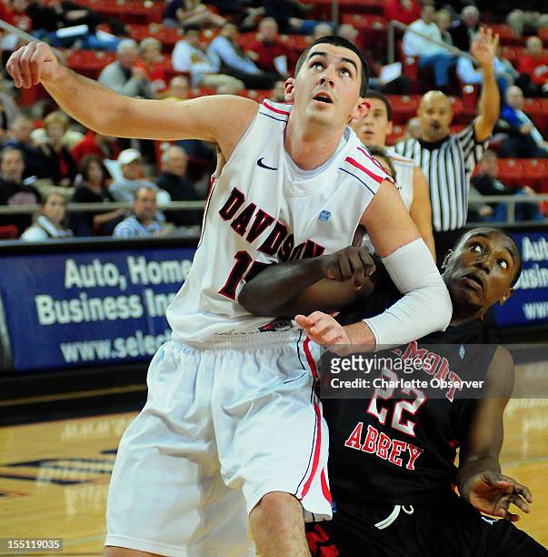 Davidson's Jake Cohen and Belmont Abbey's Jay Council fight for position on a rebound during first-half action on Thursday, November 1 at John M....