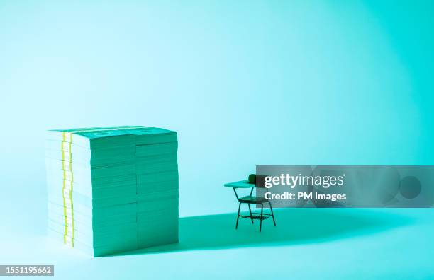 the cost of education - money and desk - tuition stock pictures, royalty-free photos & images