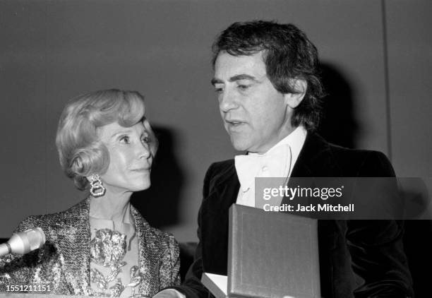 Philanthropist Mitzi Newhouse listens as producer Joseph Papp speaks during the opening night of Lincoln Center's Mitzi Newhouse Theatre, New York,...