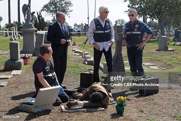 Fallen Angels" -- David Phillips along with Captain Jim Brass , D.B. Russell and Nick Stokes confer with one another at a grave site in this scene,...