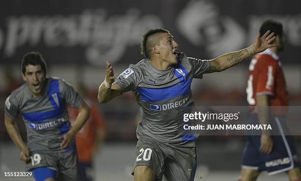 Chile's Universidad Catolica forward Kevin Harbottle celebrates after scoring team's second goal against Argentina's Independiente during their Copa...
