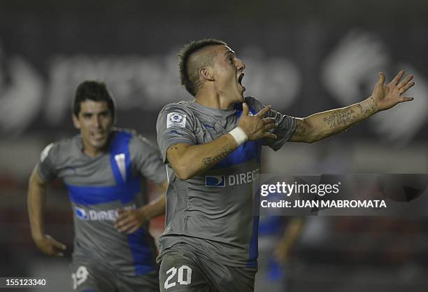Chile's Universidad Catolica forward Kevin Harbottle celebrates after scoring team's second goal against Argentina's Independiente during their Copa...