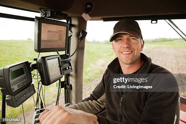 demonstrating hi-tech farming equipment - farmer fertilizer stock pictures, royalty-free photos & images