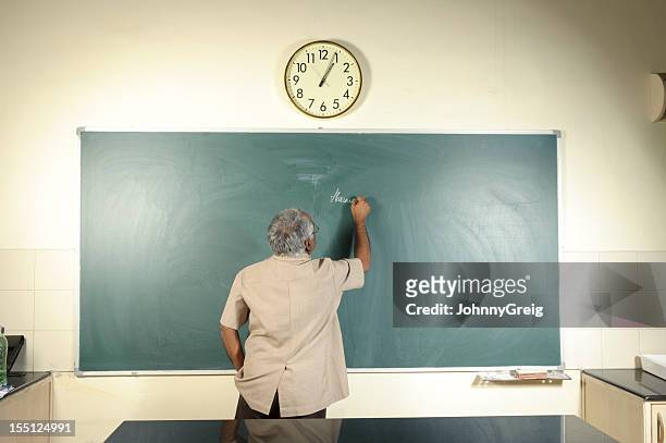 university professor writing on blackboard - teacher stock pictures, royalty-free photos & images