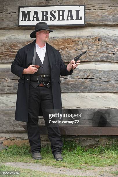 marshal of the old american west with pistols drawn - western pennsylvania stock pictures, royalty-free photos & images