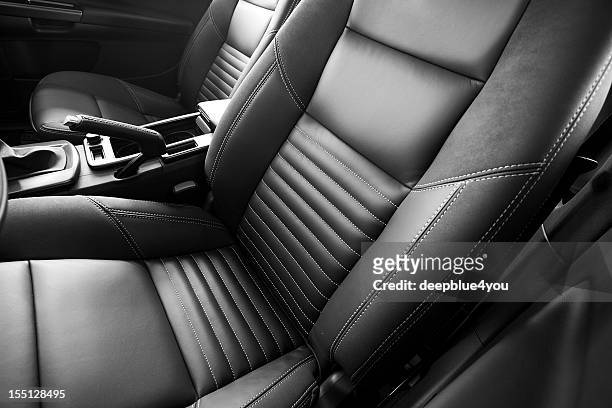 leather car seats close up - voertuiginterieur stockfoto's en -beelden