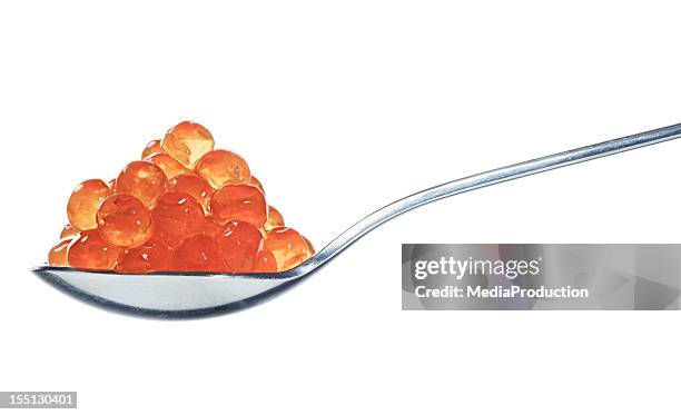 salmon eggs on spoon - fish roe stock pictures, royalty-free photos & images