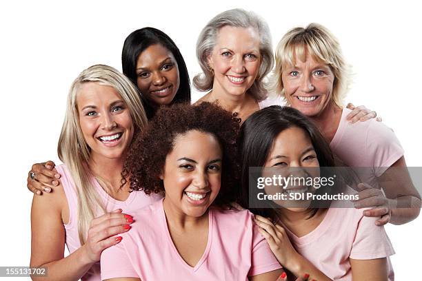 diverse group of happy women in pink - human age stock pictures, royalty-free photos & images
