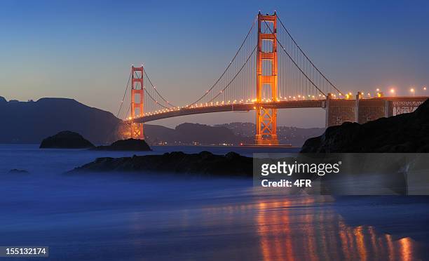 golden gate bridge at twilight (xxxl) - baker beach stock pictures, royalty-free photos & images