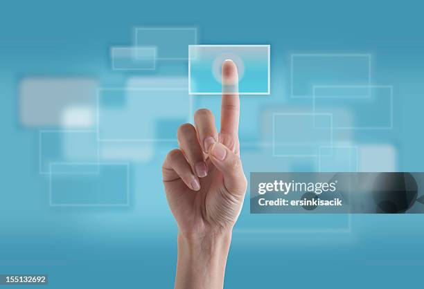 finger touching transparent digital touch screen - finger tablet stock pictures, royalty-free photos & images