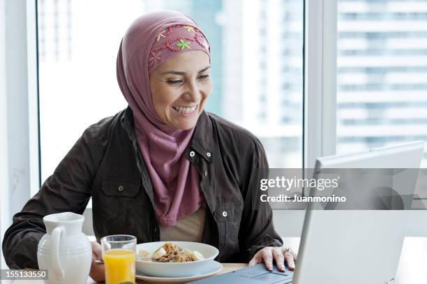 muslim woman having breakfast - iranian people stock pictures, royalty-free photos & images