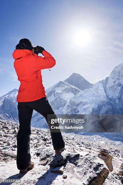 sunrise over mount everest, himalaya, nepal - woman looking through ice stock pictures, royalty-free photos & images