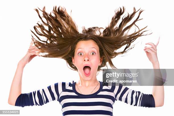 awe menina adolescente com cabelo a voar e expressão de surpresa - teenager staring imagens e fotografias de stock