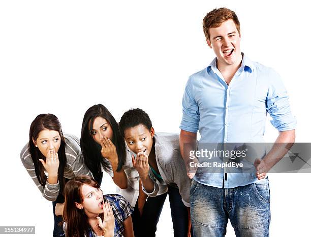 confident, winking young man indicates his size to shocked girls - penis humour stock pictures, royalty-free photos & images