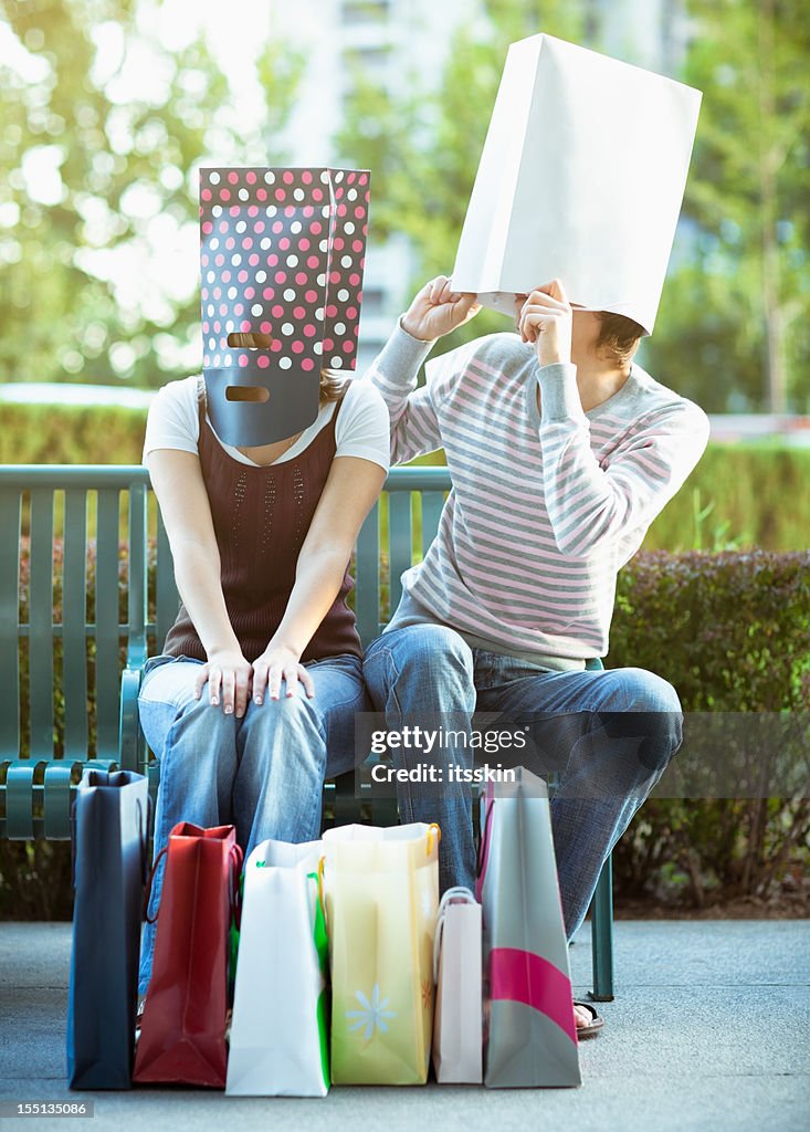 Bag-headed couple after shopping