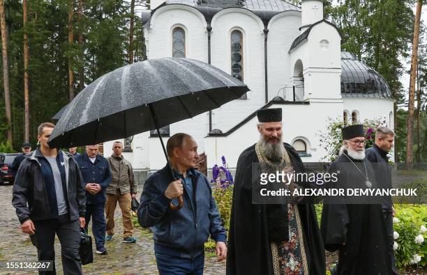 Russian President Vladimir Putin and his Belarus' counterpart Alexander Lukashenko visit the Valaam Monastery on Valaam island in the northern...