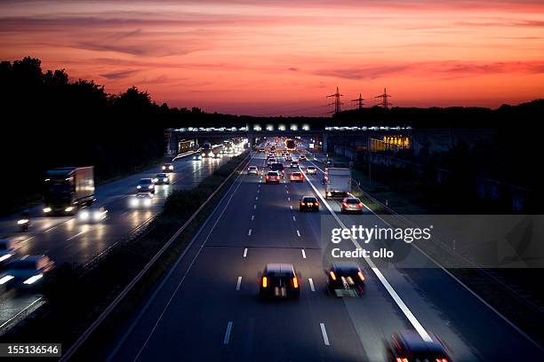 german autobahn at dusk, long exposure - autobahn stock pictures, royalty-free photos & images