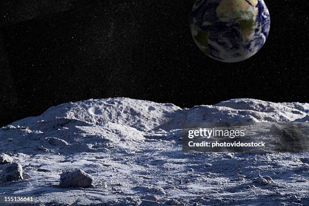 moon surface with distant earth and starfield - volcanic crater stockfoto's en -beelden