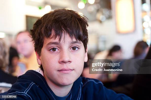 young boy looking at the camera - 12 year old cute boys stock pictures, royalty-free photos & images