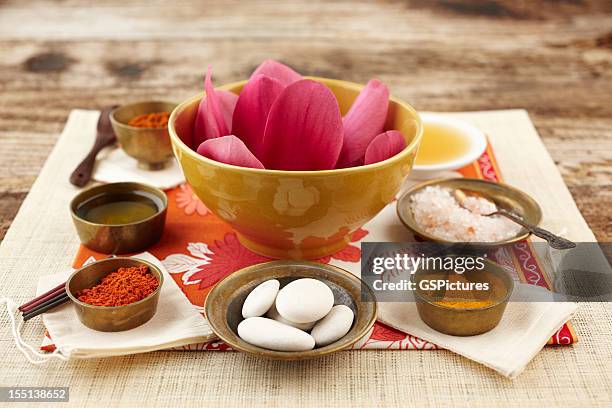 still life with magnolia flower, turmeric and sandalwood powder, scrubbing - powder snow stock pictures, royalty-free photos & images