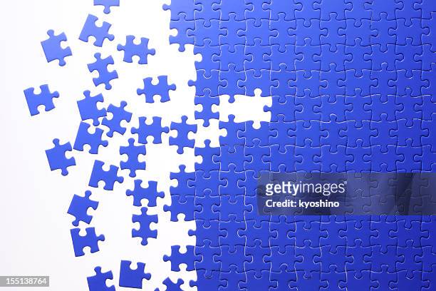 isolated shot of blue jigsaw puzzle on white background - connect the dots puzzle stock pictures, royalty-free photos & images