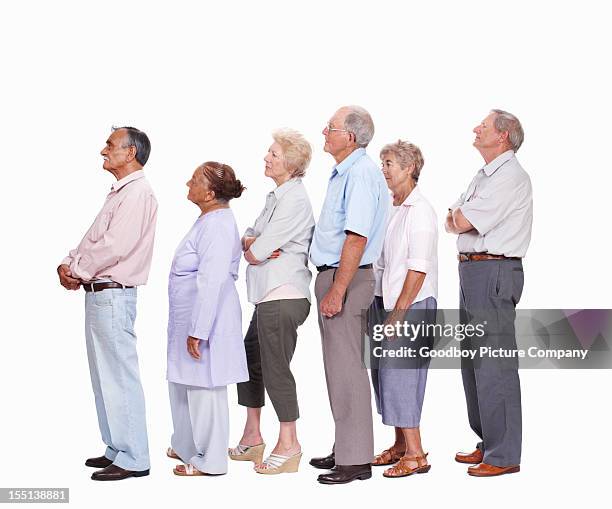 mixed race seniors queuing - mixed race man standing studio stockfoto's en -beelden
