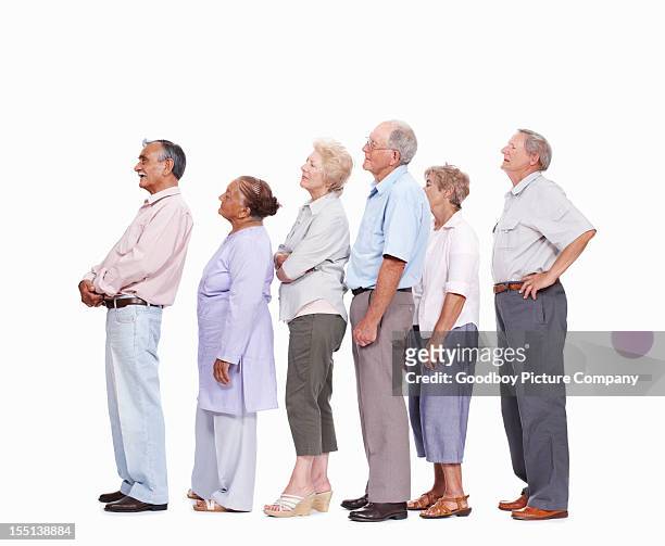seniors waiting in queue - people standing in a row stock pictures, royalty-free photos & images