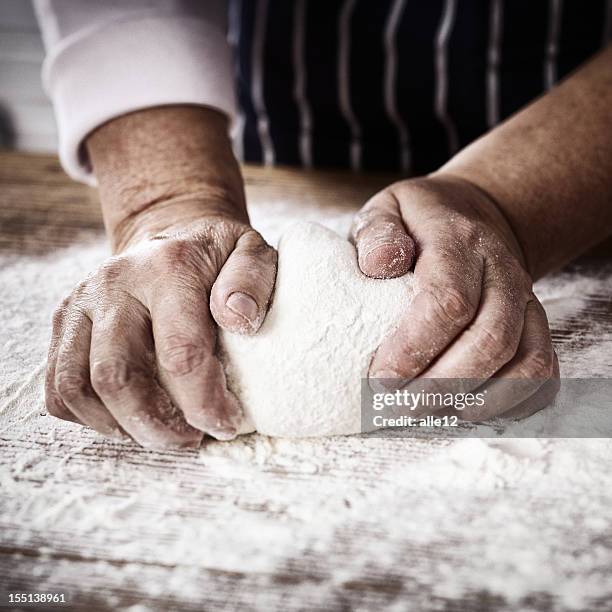 making yeast dough - knåda bildbanksfoton och bilder