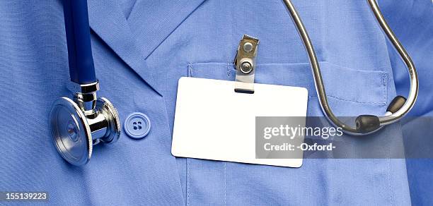 lab coat with id - naamplaatje etiket stockfoto's en -beelden