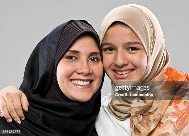 middle eastern mother and her daughter - moroccan girls stock pictures, royalty-free photos & images