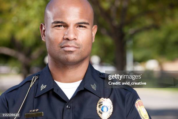 african american police officer portrait - police badge stock pictures, royalty-free photos & images