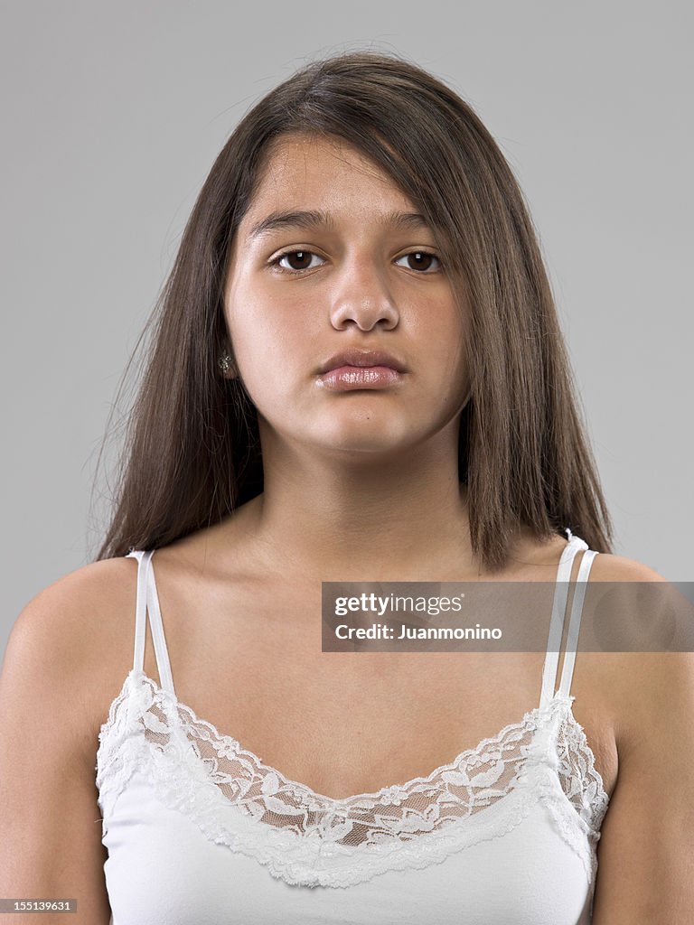 Serious thirteen years old hispanic girl