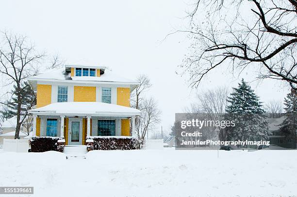 traditional home in a snow storm - iowa v minnesota stockfoto's en -beelden