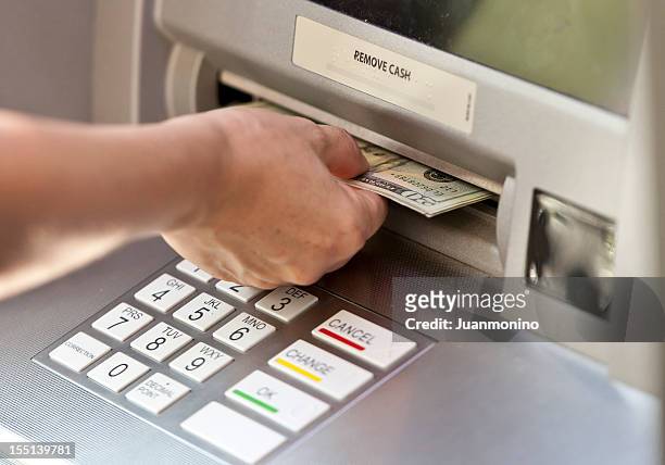 getting the cash - atm stock pictures, royalty-free photos & images