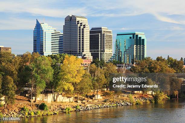 river and buildings at sacramento, california - california capitol stock pictures, royalty-free photos & images