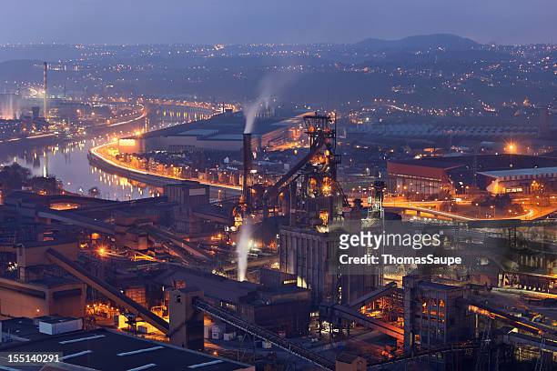 steel mill at night - liege belgium stock pictures, royalty-free photos & images