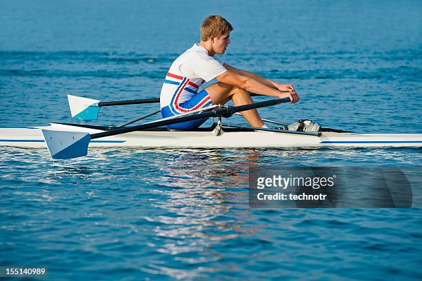 young  rowing man in the action - row racing stock pictures, royalty-free photos & images