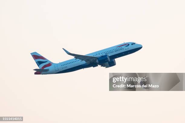 British Airways comercial flight flies after take off from the Adolfo Suarez Madrid Barajas Airport. The beginning of summer has recorded the...