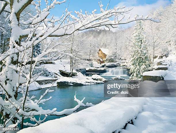 nostalgic gristmill in snowy winter country scene - frozen waterfall stock pictures, royalty-free photos & images