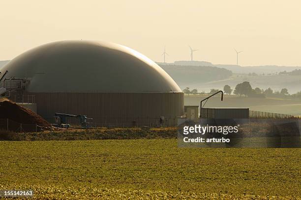 bio gas power plant and wind generators for alternative energy - wind energy storage stock pictures, royalty-free photos & images