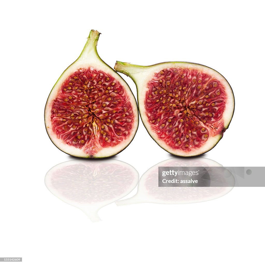 Two halves of figs isolated on white background
