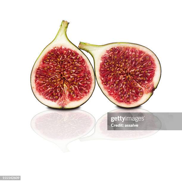 two halves of figs isolated on white background - half and half stock pictures, royalty-free photos & images