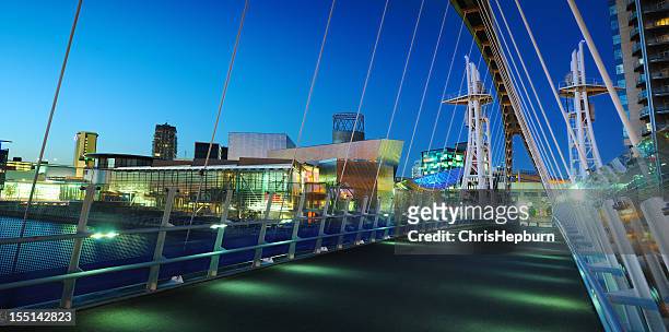 millennium bridge, salford quays, manchester - salford stock pictures, royalty-free photos & images