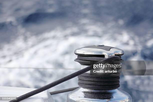 sailing yacht rope and winch against blue white ocean - cable winch stock pictures, royalty-free photos & images