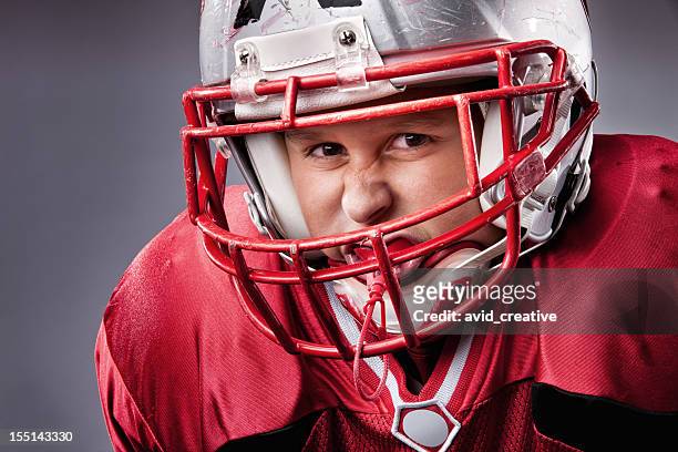 little league football player - football player face stock pictures, royalty-free photos & images
