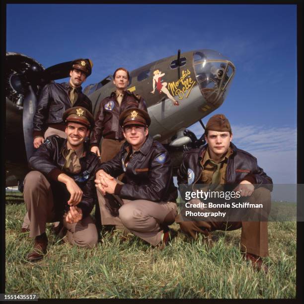 Actors Matthew Modine, Eric Stoltz, Harry Connick Jr, Sean Astin and Billy Zane pose in costume in front of a war plane for the film Memphis Belle in...